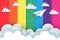 White paper planes fly on the background rainbow colorful while flying above a cloud