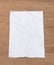 White paper sheet, paper crumpled on a wooden floor