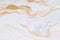 White paper sheet texture background. Flowing colors. Golden and silver fluid color pattern