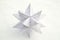 White paper star on snow