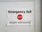 White paper stop emergency exit alarm will sound sign on door