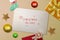 White paper with text Christmas in July with christmas decoration