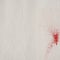 White paper towel with red splatters