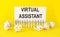 White paper on the yellow background with text Virtual Assistant