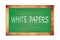 WHITE  PAPERS text written on green school board