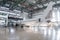 White passenger airliner in the aviation hangar. Airplane under maintenance