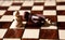 White Pawn beat black chess king on board background