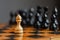 White pawn, in front of black, on a chessboard. Selective focus. Correct move. Strategy. Sport. Business.