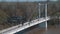 White pedestrian bridge crossing the Ural river