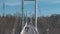 White pedestrian bridge crossing the Ural river