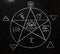 White pentagram symbol on the blackboard photo.