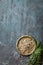 White pepper and fresh rosemary twigs, culinary ingredients on dark background