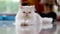 A white persian cat lying on the ground with eyes look back and forth.