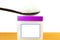 White petroleum jelly in spoon with jar in white background