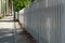 White picket fence along sidewalk