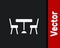 White Picnic table with chairs on either side of the table icon isolated on black background. Vector
