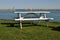 White picnic table near water