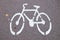 White picture bike on the bicycle path. Bicycle road sign on asphalt