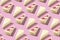 White piece slice cheesecake pattern on pink background