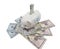 A white piggy bank against a white background watches over a pile of United States currency. Wealth, Savings, inflation concept -