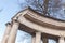 White pillars of classical portico under blue sky