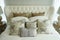 White pillows setting on English country style bedding