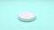 White pills isolated rotating on green background. Seamless looping.