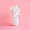 White pineapple on pink pastel color background.