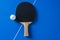 White ping pong ball and racket for playing ping pong. Top view. Sports concept