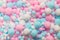 White, pink and blue soft pompons