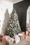 White and pink christmas background tree eve, fireplace decorations gift boxes, basket with pines, balls and snow