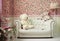 White and pink cozy room with flowers teddy bears white sofa and lamp