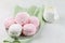 White and pink marshmallows, milk and a green linen napkin.