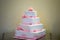 White and pink square storey wedding cake