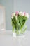 White and pink tulips on a white table were used as a Spring dec