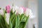 White and pink tulips on a white table were used as a Spring dec