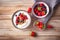 White plain greek yogurt with fresh berries and granola