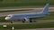 White plane doing taxi on Munich Airport, blue sky