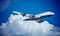 White plane flying in sky and clouds. Airplane boeing 747