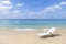 White plastic beach chair on tropical beach, relax by the sea