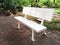 White plastic bench in the garden