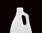 A White Plastic Blank detergent bottle with holder isolated on black background.