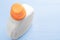 White plastic bottle with a bright orange cap with liquid washing powder or bleach and fabric softener