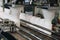 White plastic bottles on the production line of the conveyor at filling machine in the factory. selective focus