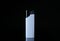 White plastic cigarette lighter on black background, closeup