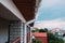 White plastic downpipe on the roof of the cottage. Side view