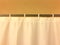 White plastic shower curtain hanging from a rod