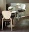 White plastic tables and chairs, cafe bar furniture