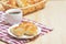 White plate with croissants, croissant basket, coffee