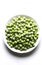 White plate of frozen green peas frozen balls